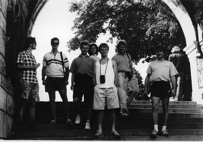 Peter, Richard, Andy C, Antonia G, John, Markus, anon.jpg -  Group at castle area of Obuda during the Budapest Atomiade 1991Peter Rodgers, Richard Pitts, Andy Chamberlain, Antonia Georgopulosz, John Henley, Markus Gammelin, Some JET runner Information provided by Richard Pitts (Jan 2007).That photo was taken during a visit to the castle area of Obuda during the Budapest Atomiade, June 1991. You see the girl 4th from the left at the back (with the stripey shirt)? That's Antonia Georgopulosz - she was our appointed guide and translator for the weekend back then. She actually replaced a friend, who had been "assigned" to us, when that friend fell ill just before the Atomiade. At the end of the weekend, Antonia and I exchanged addresses, just as friends - she asked if we could keep in touch so that she could practise her English in letters etc. We met again 3 years later when I was visiting the KFKI in Budapest to give a seminar on my work in Lausanne. We married in June 1996 and have a ten-year-old daughter! Quite nostalgic for me seeing that photo.